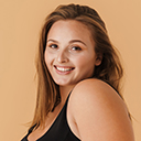 Young woman wearing swimsuit smiling and looking at camera